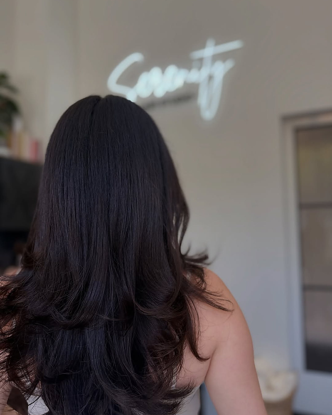 Soft layers and a fresh gloss — Brunette gloss, cut and finished in the suite