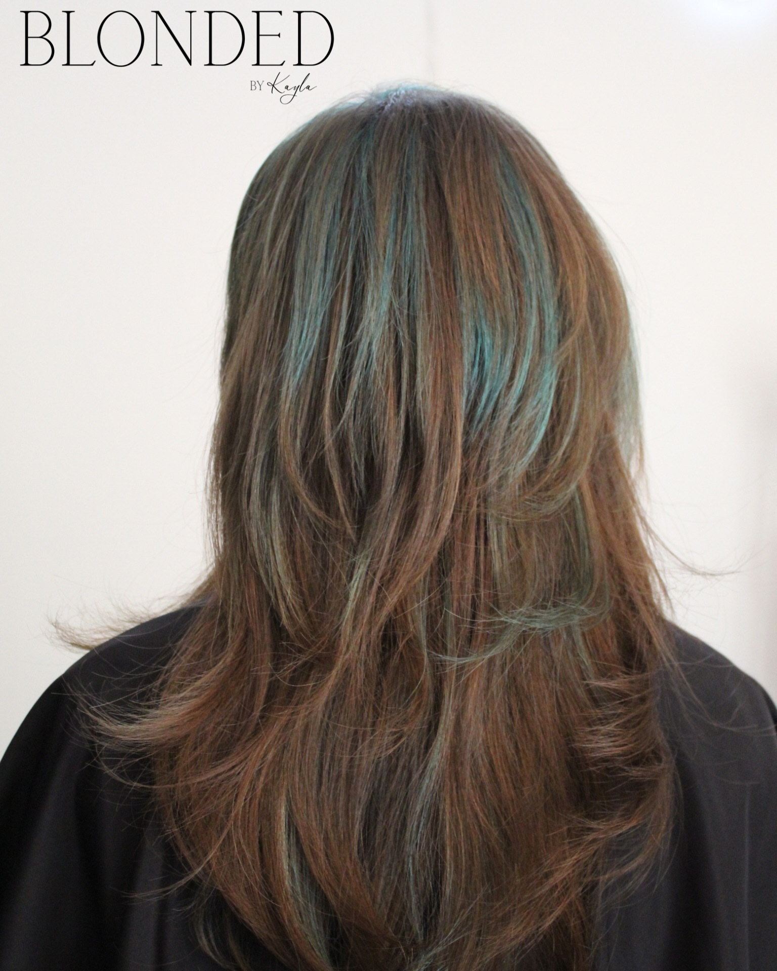 2000s shag, peekaboo teal — Heavy side bangs, long layers, hidden color